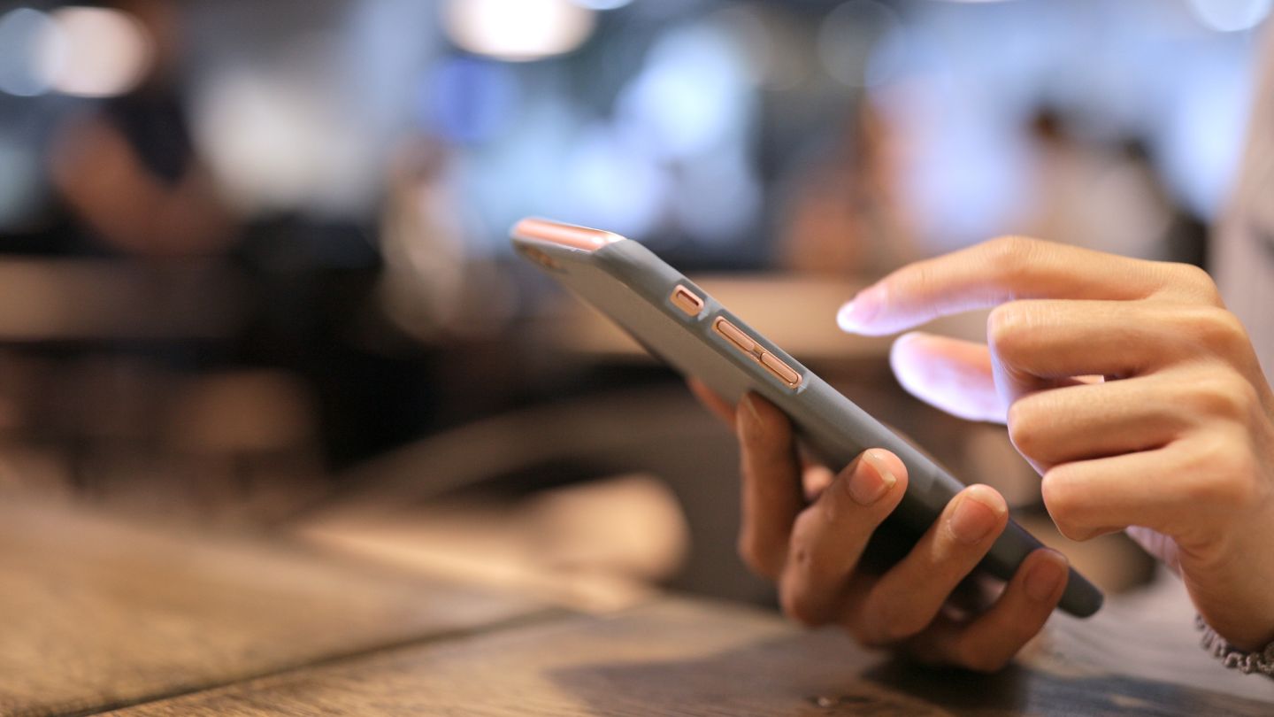 Close Up Of Person Using Smartphone