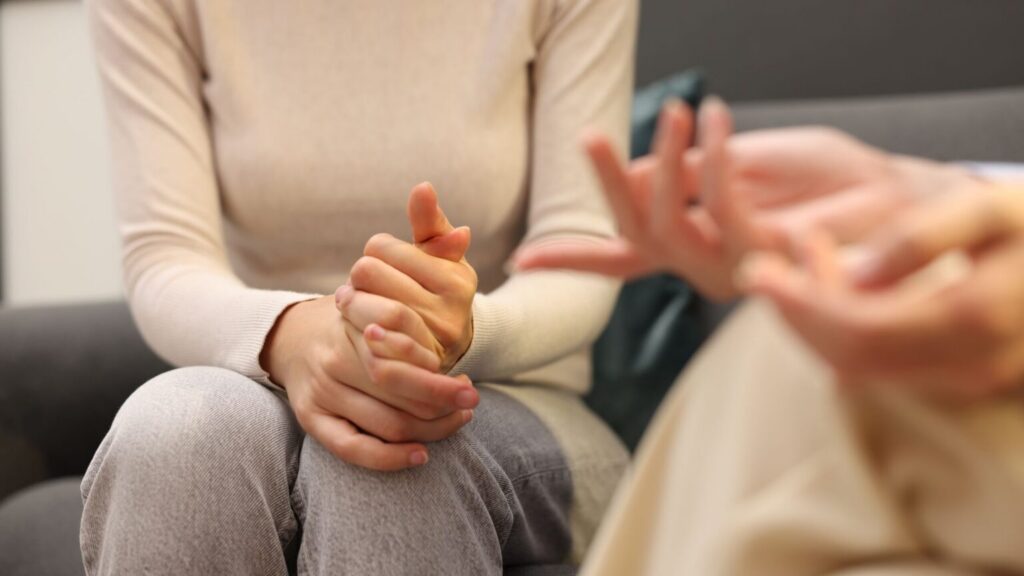 person discussing physical health with therapist