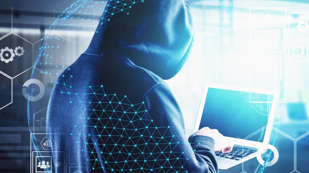 Person In A Hoodie Using A Laptop