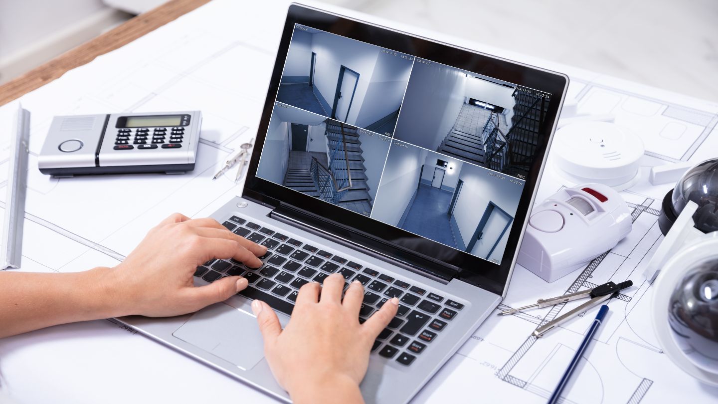 Person Monitoring Building Footage Through Security Cameras